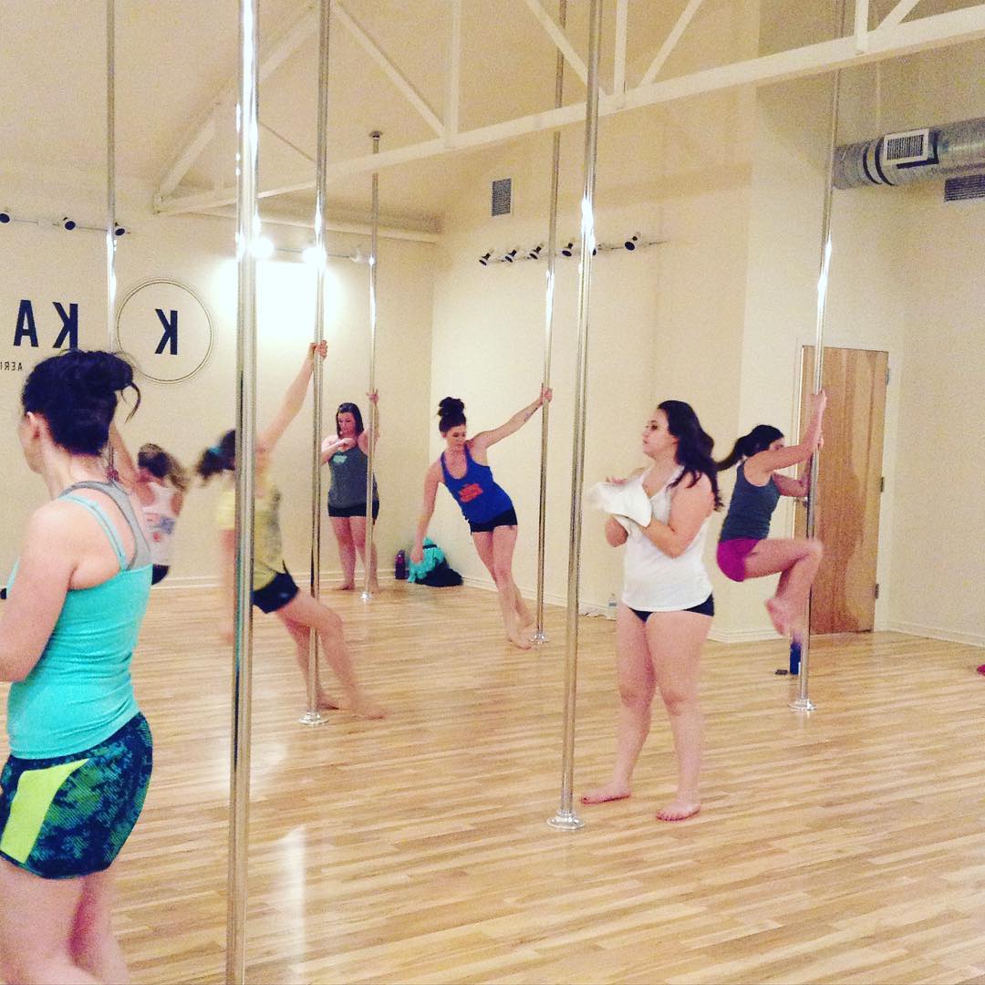 Pole fitness class in studio